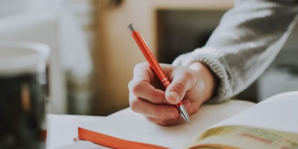 Photo of someone writing